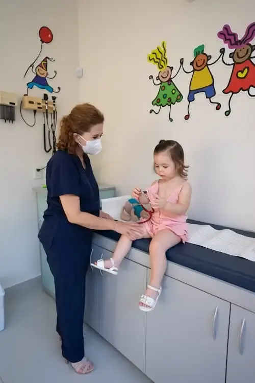 image of a nurse with a sick kiddo